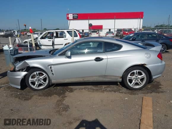 2005 Hyundai Tiburon GT с VIN KMHHN65F05U185005, выставлен на аукционе IAAI как лот 42596711 с пробегом 209 701 миль миль и . История ставок и продаж доступна на DreamBid. Изображение 14.