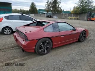 ✅ 1987 Pontiac Fiero GT • VIN: 1G2PG1199HP214795 • Lot: 75901054. Wystawiony na Copart z przebiegiem 206 675 mil. Bezpłatny archiwum sprzedaży aukcyjnych z USA i szczegółowy raport historii pojazdu na DreamBid. Zdjęcie 3.