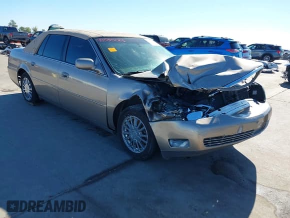 ✅ 2004 Cadillac DeVille DHS • VIN: 1G6KE57Y34U138359 • Lot: 43535083. Listed on IAAI with 84,329 mi. Free auction sales archive from the USA and detailed vehicle history report at DreamBid. Image 1.