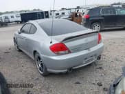 ✅ 2005 Hyundai Tiburon GS • VIN: KMHHM65D85U174335 • Лот: 39373771. Опубликован ранее на IAAI с пробегом 117 296 миль. Бесплатный доступ к архиву аукционных продаж из США и подробный отчёт об истории автомобиля на DreamBid. Изображение 3.