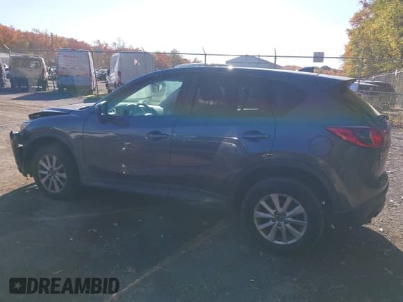 ✅ 2016 Mazda CX-5 Touring • VIN: JM3KE4CY5G0716056 • Lot: 43521281. Listed on IAAI with 107,968 mi. Free auction sales archive from the USA and detailed vehicle history report at DreamBid. Image 14.