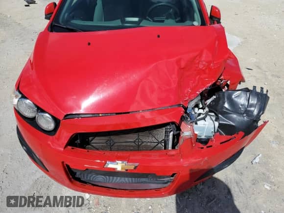 2014 Chevrolet Sonic LS z VIN 1G1JA5SH6E4128074, wystawiony jako Copart lot #69489934 z przebiegiem 104 912 mil mil oraz Szkoda całkowita • Salvage title. Historia ofert i sprzedaży dostępna na DreamBid. Obrazek 11.