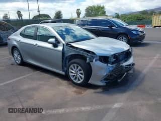 2023 Toyota Camry LE with VIN 4T1C11AK1PU115527, listed as a IAAI auction lot 43097637 with 23,926 mi miles and . Bid and sale history available at DreamBid. Image 1.