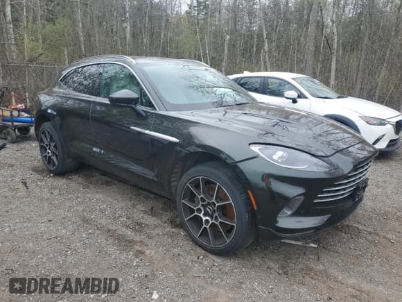 ✅ 2022 Aston Martin DBX • VIN: SD7VUJAWXNTV04208 • Lot: 51604705. Listed on Copart with 30,667 mi. Free auction sales archive from the USA and detailed vehicle history report at DreamBid. Image 4.