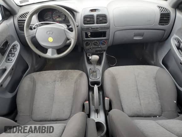 2005 Hyundai Accent GLS с VIN KMHCG45C05U605523, выставлен на аукционе Copart как лот 43811815 с пробегом 190 638 миль миль и Списание • Salvage title. История ставок и продаж доступна на DreamBid. Изображение 8.