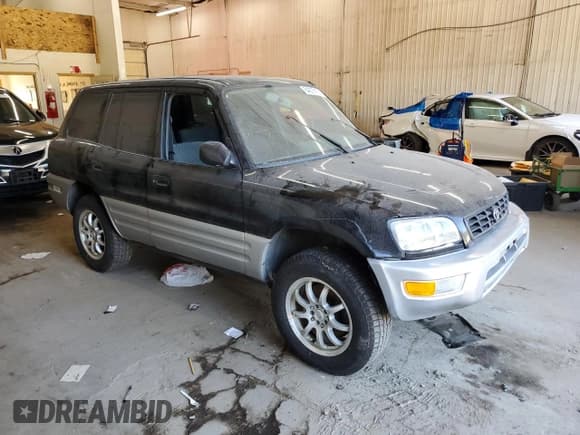 ✅ 2000 Toyota RAV4 • VIN: JT3HP10V4Y0232794 • Lot: 84278185. Listed on Copart with 243,884 mi. Free auction sales archive from the USA and detailed vehicle history report at DreamBid. Image 4.