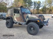 ✅ 2002 Jeep Wrangler Sport • VIN: 1J4FA49S82P750818 • Lot: 93632335. Wystawiony na Copart z przebiegiem 237 984 mil. Bezpłatny archiwum sprzedaży aukcyjnych z USA i szczegółowy raport historii pojazdu na DreamBid. Zdjęcie 4.