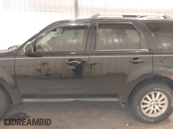 2010 Mercury Mariner Premier with VIN 4M2CN9HG2AKJ19690, listed as a IAAI auction lot 43221081 with 136,828 mi miles and . Bid and sale history available at DreamBid. Image 14.