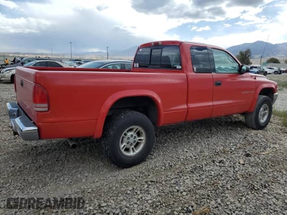 1999 Dodge Dakota SLT z VIN 1B7GG22X7XS101535, wystawiony jako Copart lot #71592334 z przebiegiem 151 644 mil mil oraz Szkoda całkowita • Salvage title. Historia ofert i sprzedaży dostępna na DreamBid. Obrazek 3.