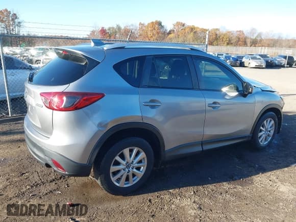 ✅ 2014 Mazda CX-5 Touring • VIN: JM3KE4CY3E0393283 • Lot: 43686574. Wystawiony na IAAI z przebiegiem 122 569 mil. Bezpłatny archiwum sprzedaży aukcyjnych z USA i szczegółowy raport historii pojazdu na DreamBid. Zdjęcie 14.