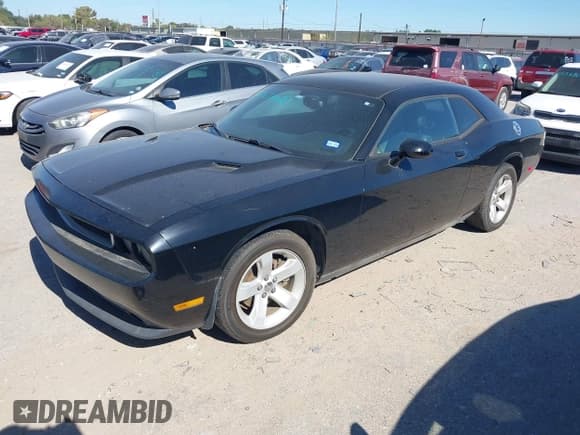 ✅ 2012 Dodge Challenger SXT Plus • VIN: 2C3CDYAG7CH257561 • Lot: 43670021. Listed on IAAI with 163,751 mi. Free auction sales archive from the USA and detailed vehicle history report at DreamBid. Image 2.