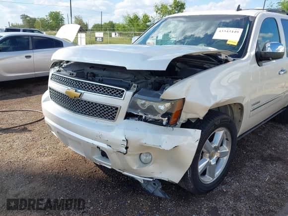 2013 Chevrolet Tahoe LTZ with VIN 1GNSCCE09DR357731, listed as a IAAI auction lot 43343449 with 148,667 mi miles and . Bid and sale history available at DreamBid. Image 6.