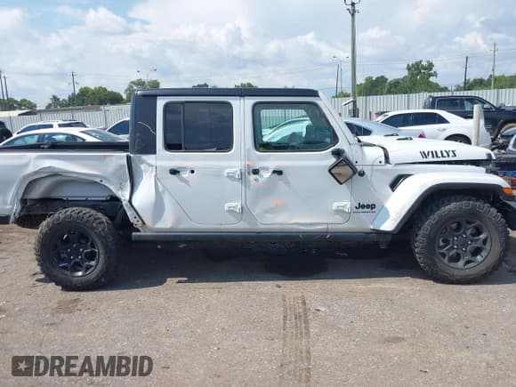 ✅ 2023 Jeep Gladiator Sport S • VIN: 1C6HJTAG6PL542989 • Lot: 42987749. Listed on IAAI with 14,847 mi. Free auction sales archive from the USA and detailed vehicle history report at DreamBid. Image 14.
