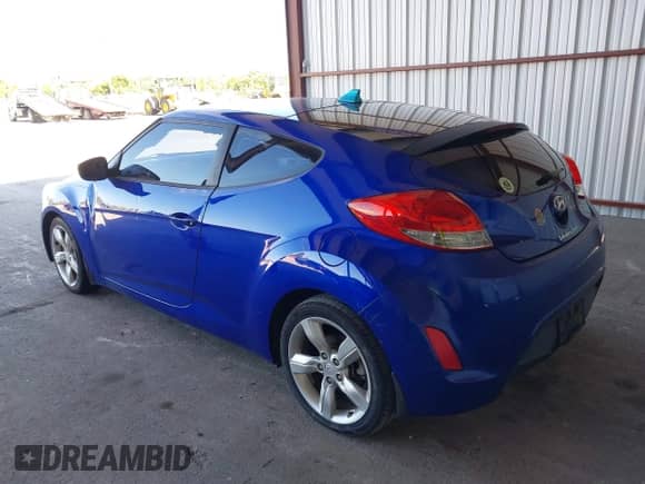 2012 Hyundai Veloster w/Red Int with VIN KMHTC6AD1CU042131, listed as a IAAI auction lot 43596089 with 161,968 mi miles and . Bid and sale history available at DreamBid. Image 3.
