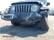 ✅ 2022 Jeep Wrangler Unlimited Sahara • VIN: 1C4HJXEM7NW206585 • Lot: 42102516. Listed on IAAI with 10,769 mi. Free auction sales archive from the USA and detailed vehicle history report at DreamBid. Image 18.