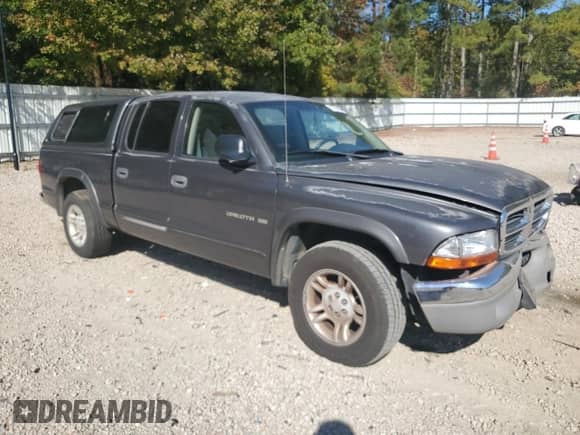 2002 Dodge Dakota SLT z VIN 1B7HL48N42S522901, wystawiony jako Copart lot #76783334 z przebiegiem 247 517 mil mil oraz Szkoda całkowita • Salvage title. Historia ofert i sprzedaży dostępna na DreamBid. Obrazek 4.