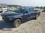 2003 Dodge Dakota Sport с VIN 1D7HL38X33S319159, выставлен на аукционе Copart как лот 69791754 с пробегом 214 326 миль миль и Списание • Salvage title. История ставок и продаж доступна на DreamBid. Изображение 1.