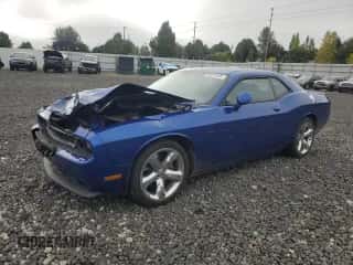 2012 Dodge Challenger SXT Plus с VIN 2C3CDYAG4CH290985, выставлен на аукционе Copart как лот 82078265 с пробегом 162 825 миль миль и Списание • Salvage title. История ставок и продаж доступна на DreamBid. Изображение 1.