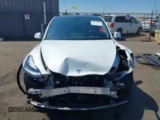 ✅ 2023 Tesla Model Y Long Range • VIN: 7SAYGAEE3PF826073 • Lot: 43104047. Listed on IAAI with 34,524 mi. Free auction sales archive from the USA and detailed vehicle history report at DreamBid. Image 6.