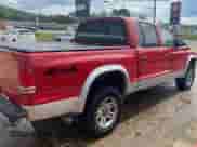 2004 Dodge Dakota SLT with VIN 1D7HG48N74S718165, listed as a Copart auction lot 73542004 with 213,326 mi miles and Clean title. Bid and sale history available at DreamBid. Image 4.