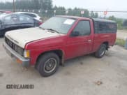 ✅ 1993 Nissan Frontier • VIN: 1N6SD11S6PC310288 • Lot: 43143437. Listed on IAAI with 228,866 mi. Free auction sales archive from the USA and detailed vehicle history report at DreamBid. Image 2.