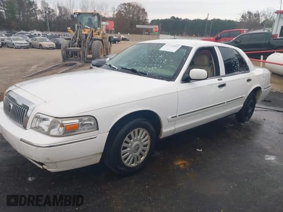 ✅ 2007 Mercury Grand Marquis LS • VIN: 2MEFM75V97X628354 • Lot: 43775885. Listed on IAAI with 74,013 mi. Free auction sales archive from the USA and detailed vehicle history report at DreamBid. Image 2.