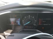 ✅ 2016 Ford Fusion Titanium Hybrid • VIN: 3FA6P0RU4GR125580 • Лот: 70785425. Опубликован ранее на Copart с пробегом 105 472 миль. Бесплатный доступ к архиву аукционных продаж из США и подробный отчёт об истории автомобиля на DreamBid. Изображение 9.