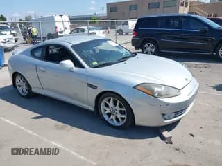 ✅ 2007 Hyundai Tiburon GT • VIN: KMHHN66F97U253187 • Лот: 40457431. Опубликован ранее на IAAI с пробегом 118 312 миль. Бесплатный доступ к архиву аукционных продаж из США и подробный отчёт об истории автомобиля на DreamBid. Изображение 1.
