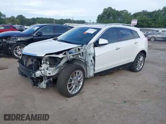 ✅ 2015 Cadillac SRX Performance Collection • VIN: 3GYFNFE34FS547964 • Lot: 43112616. Listed on IAAI with 101,352 mi. Free auction sales archive from the USA and detailed vehicle history report at DreamBid. Image 2.