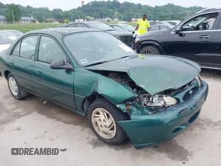 ✅ 1999 Ford Escort LX • VIN: 1FAFP10P1XW230023 • Lot: 42486934. Listed on IAAI with 41,468 mi. Free auction sales archive from the USA and detailed vehicle history report at DreamBid. Image 1.