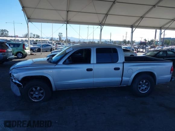 ✅ 2003 Dodge Dakota SLT • VIN: 1D7HL48N13S294573 • Lot: 41291127. Wystawiony na IAAI z przebiegiem 227 355 mil. Bezpłatny archiwum sprzedaży aukcyjnych z USA i szczegółowy raport historii pojazdu na DreamBid. Zdjęcie 14.