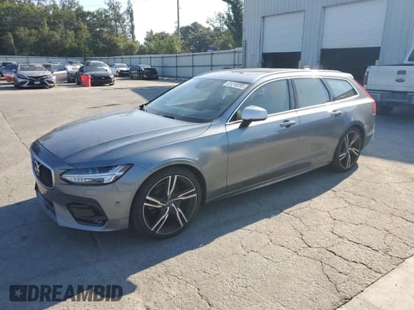 ✅ 2019 Volvo V90 R-Design • VIN: YV1102GM4K1091676 • Лот: 81310285. Опубликован ранее на Copart с пробегом 55 942 миль. Бесплатный доступ к архиву аукционных продаж из США и подробный отчёт об истории автомобиля на DreamBid. Изображение 1.