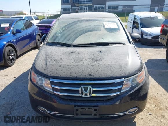 ✅ 2014 Honda Odyssey Touring • VIN: 5FNRL5H99EB051715 • Lot: 43405838. Listed on IAAI with 176,921 mi. Free auction sales archive from the USA and detailed vehicle history report at DreamBid. Image 12.
