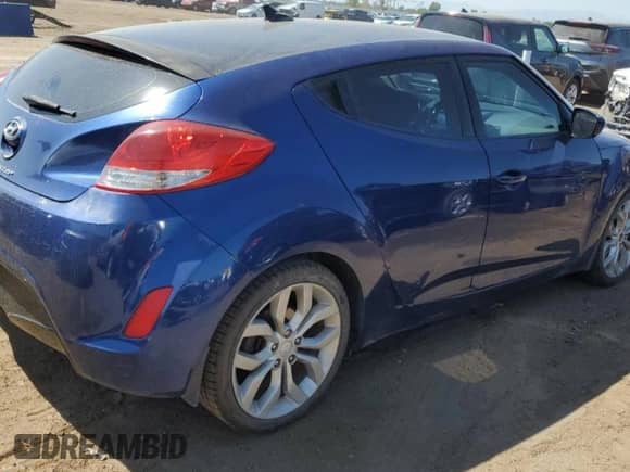 2015 Hyundai Veloster z VIN KMHTC6AD0FU241885, wystawiony jako Copart lot #70447094 z przebiegiem 175 075 mil mil oraz Szkoda całkowita • Salvage title. Historia ofert i sprzedaży dostępna na DreamBid. Obrazek 3.