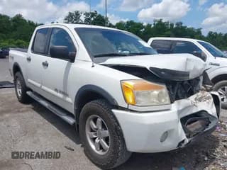 ✅ 2012 Nissan Titan SL • VIN: 1N6BA0EC9CN312914 • Lot: 42290316. Listed on IAAI with 227,485 mi. Free auction sales archive from the USA and detailed vehicle history report at DreamBid. Image 1.