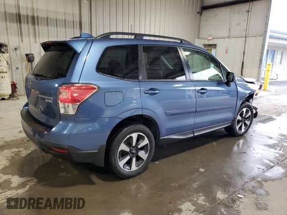 2017 Subaru Forester Limited with VIN JF2SJAJC5HH527843, listed as a Copart auction lot 82440135 with 64,197 mi miles and Salvage title. Bid and sale history available at DreamBid. Image 3.