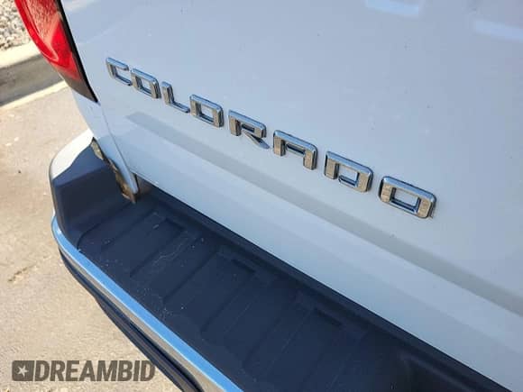 2022 Chevrolet Colorado 4WD Work Truck z VIN 1GCHTBEA7N1308582, wystawiony jako IAAI lot #43600269 z przebiegiem 79 030 mil mil oraz . Historia ofert i sprzedaży dostępna na DreamBid. Obrazek 24.