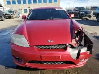 2006 Hyundai Tiburon GT z VIN KMHHN65F16U207031, wystawiony jako Copart lot #83851394 z przebiegiem 119 625 mil mil oraz Szkoda całkowita • Salvage title. Historia ofert i sprzedaży dostępna na DreamBid. Obrazek 5.