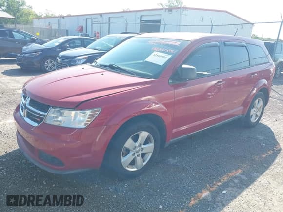 ✅ 2013 Dodge Journey Canada Value • VIN: 3C4PDCAB1DT602936 • Lot: 42565981. Listed on IAAI with 180,001 mi. Free auction sales archive from the USA and detailed vehicle history report at DreamBid. Image 2.