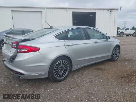 ✅ 2017 Ford Fusion Hybrid Titanium • VIN: 3FA6P0RU3HR188204 • Лот: 42618604. Опубликован ранее на IAAI с пробегом 104 609 миль. Бесплатный доступ к архиву аукционных продаж из США и подробный отчёт об истории автомобиля на DreamBid. Изображение 4.