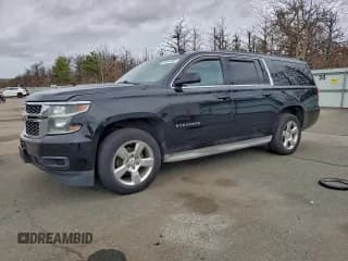 ✅ 2015 Chevrolet Suburban LT • VIN: 1GNSKJKC1FR201093 • Lot: 94524365. Listed on Copart with 327,778 mi. Free auction sales archive from the USA and detailed vehicle history report at DreamBid. Image 1.