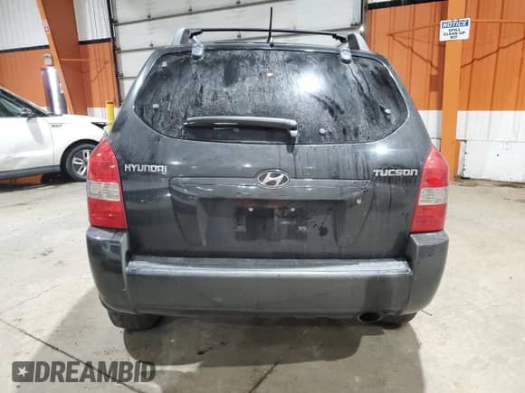 2006 Hyundai Tucson GL z VIN KM8JM12B96U289857, wystawiony jako Copart lot #83230864 z przebiegiem 222 817 mil mil oraz Szkoda całkowita • Salvage title. Historia ofert i sprzedaży dostępna na DreamBid. Obrazek 6.