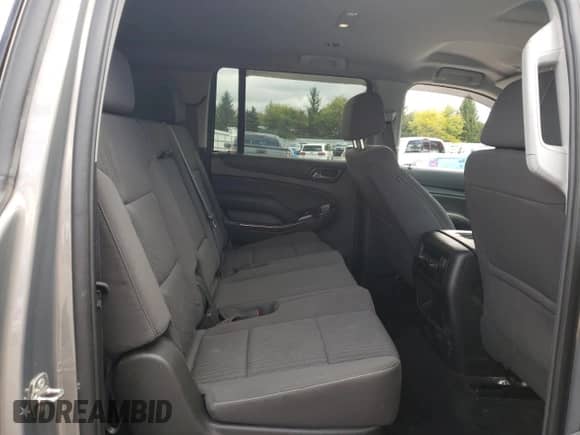 2018 Chevrolet Suburban LS z VIN 1GNSKGKC8JR396475, wystawiony jako Copart lot #75859654 z przebiegiem 67 080 mil mil oraz Szkoda całkowita • Salvage title. Historia ofert i sprzedaży dostępna na DreamBid. Obrazek 11.