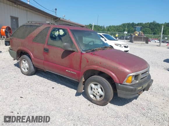 1997 Chevrolet Blazer LS z VIN 1GNCT18W7VK136406, wystawiony jako IAAI lot #42574267 z przebiegiem 185 908 mil mil oraz . Historia ofert i sprzedaży dostępna na DreamBid. Obrazek 1.