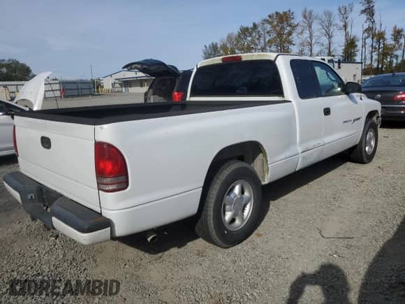 2000 Dodge Dakota z VIN 1B7GL22X2YS631036, wystawiony jako Copart lot #74635254 z przebiegiem 179 367 mil mil oraz Czysty tytuł • Clean title. Historia ofert i sprzedaży dostępna na DreamBid. Obrazek 3.