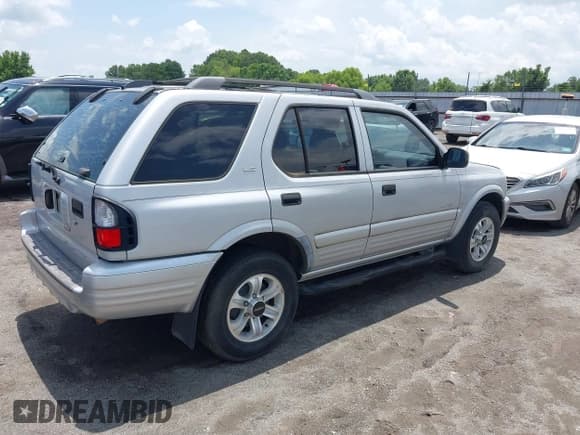 ✅ 2001 Isuzu Rodeo S • VIN: 4S2CK58W914357933 • Lot: 42427142. Listed on IAAI with 129,131 mi. Free auction sales archive from the USA and detailed vehicle history report at DreamBid. Image 4.