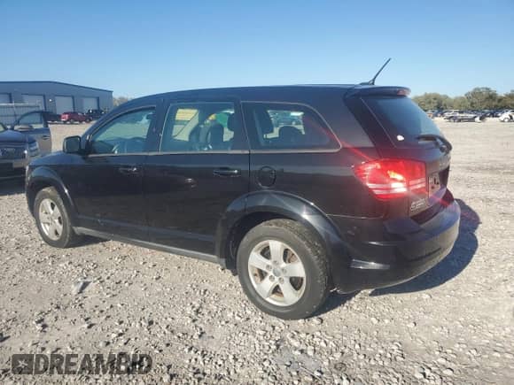 2013 Dodge Journey American Value with VIN 3C4PDCAB5DT597224, listed as a Copart auction lot 82536665 with 104,666 mi miles and Clean title. Bid and sale history available at DreamBid. Image 2.