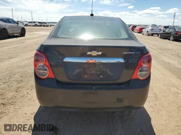 2015 Chevrolet Sonic LT с VIN 1G1JC5SH9F4132342, выставлен на аукционе Copart как лот 69644234 с пробегом 123 087 миль миль и Списание • Salvage title. История ставок и продаж доступна на DreamBid. Изображение 6.