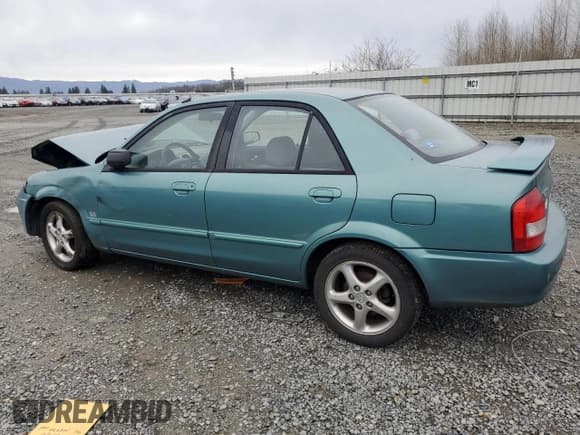 ✅ 2001 Mazda Protege LX • VIN: JM1BJ226510402231 • Lot: 46717595. Wystawiony na Copart z przebiegiem 154 138 mil. Bezpłatny archiwum sprzedaży aukcyjnych z USA i szczegółowy raport historii pojazdu na DreamBid. Zdjęcie 2.