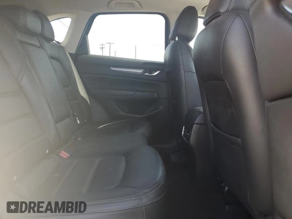 ✅ 2021 Mazda CX-5 Touring • VIN: JM3KFBCM1M1491946 • Лот: 51637245. Опубликован ранее на Copart с пробегом 57 332 миль. Бесплатный доступ к архиву аукционных продаж из США и подробный отчёт об истории автомобиля на DreamBid. Изображение 11.